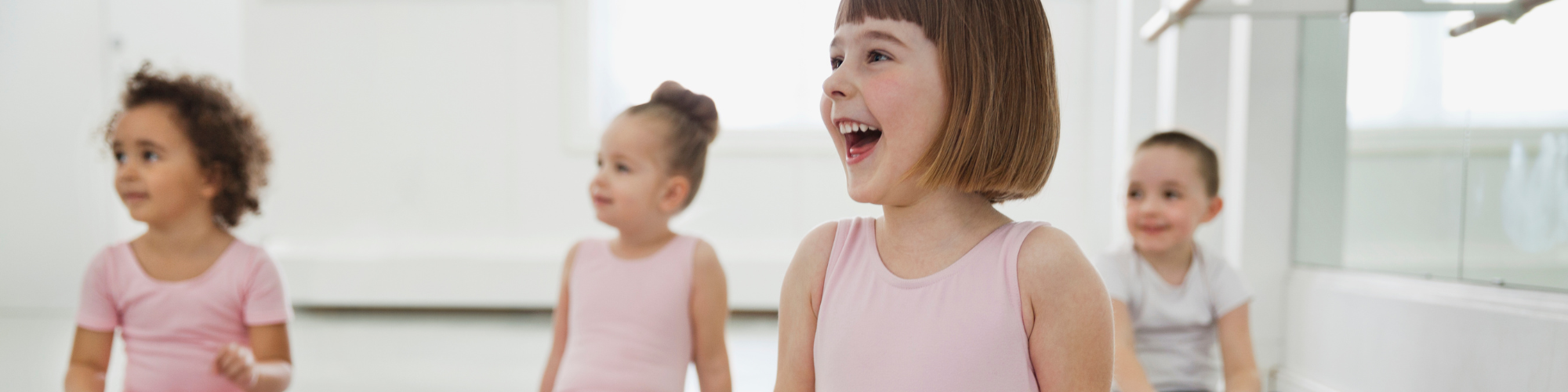 children in a ballet class in dancewear